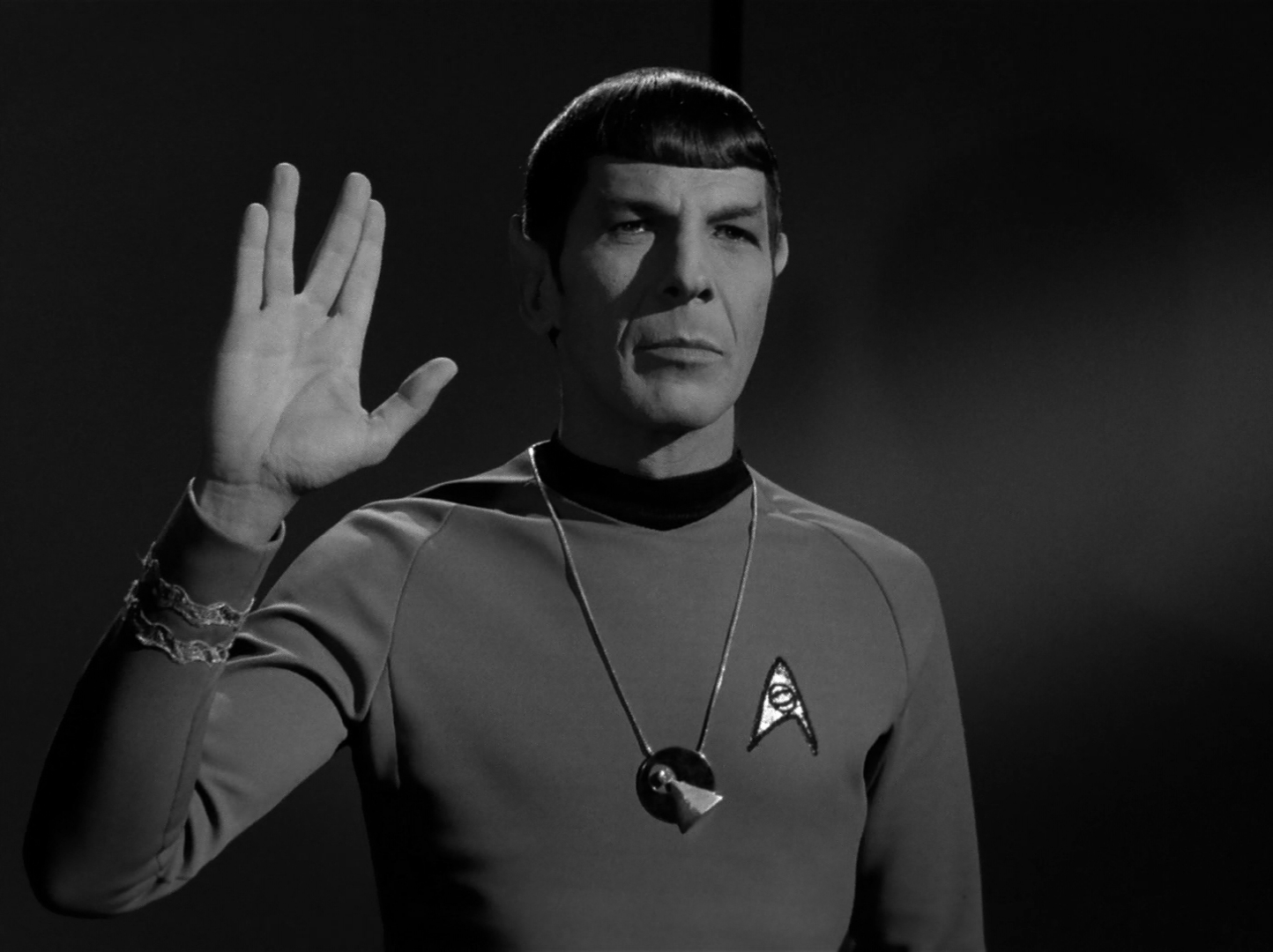 Large portrait of Leonard Nimoy as Spock holding up the Vulcan salute